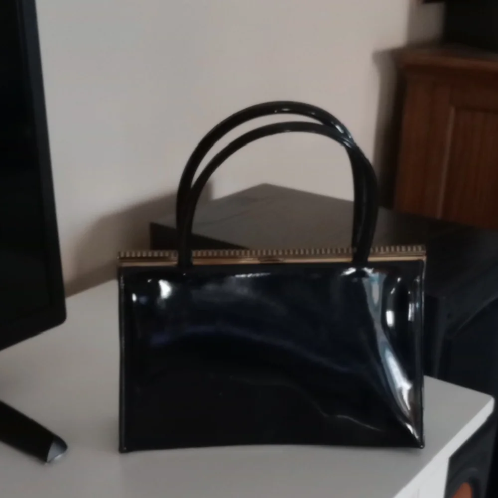 Classic Black Shoulder Bag with Glossy Material and Structured Shape - Picture 1 of 8